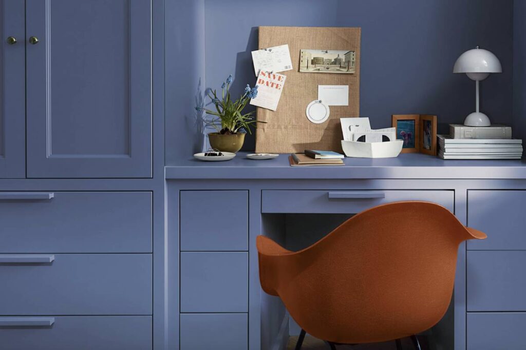An orange chair set in front of a desk and wall painted with Blue Nova near Lancaster, Pennsylvania (PA)