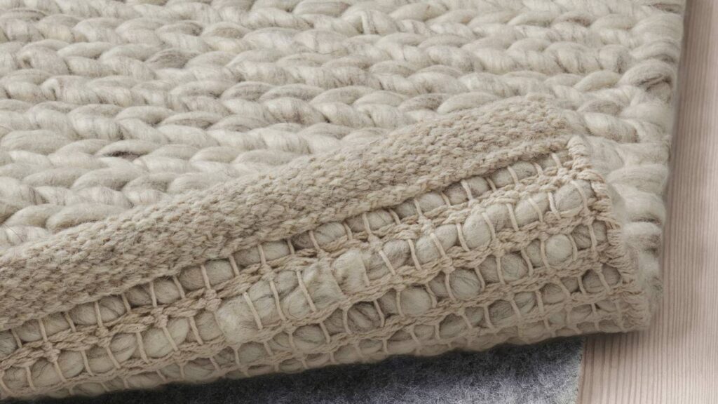 Contemporary, thick area rug for sound absorption with a rug pad beneath for better comfort near Lancaster, PA